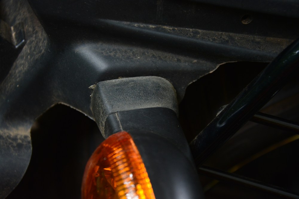 Rear Indicator assembly. Here design team thought "hey! Listen no one looks at the rear lets do one thing lets put the lowest quality rubber housing and stick it to the indicator so that it protrudes out"